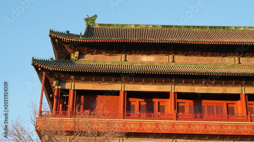 The old Forbidden city in Peking in winter with the warm sunset sunlight on them