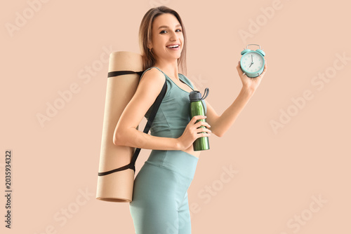 Sporty young woman with wat...