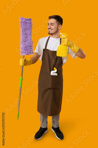 Male janitor with cleaning ...