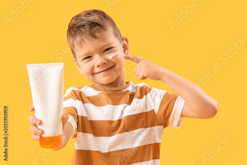 Little boy with bottle of s...
