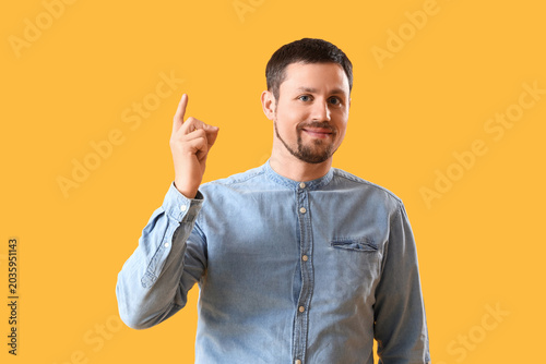 Handsome man snapping finge...