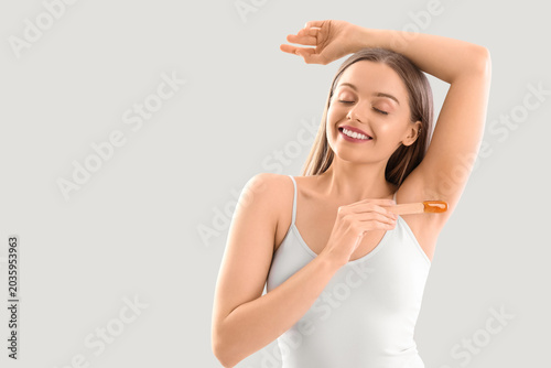 Pretty woman applying sugar...