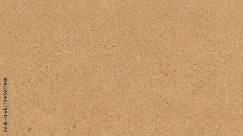 Brown kraft paper sheet - seamless background texture. Recycled cardboard carton packaging banner. Brown kraft paper texture background, recycled cardboard surface with empty copy space