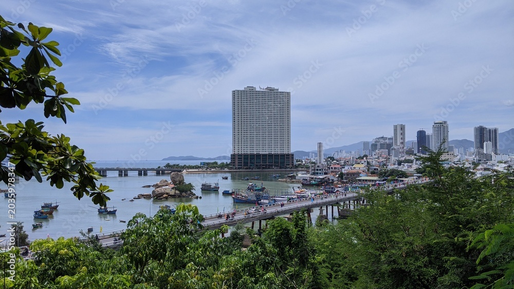 Fototapeta premium Heritage site in Nha Trang, Vietnam: Ancient Champa Kingdom's Po Nagar Towers surrounded by lush greenery