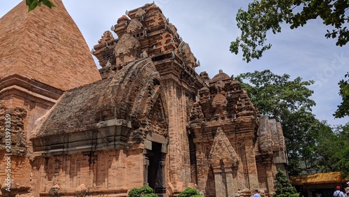 Heritage site in Nha Trang, Vietnam: Ancient Champa Kingdom's Po Nagar Towers surrounded by lush greenery