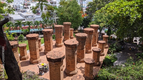 Heritage site in Nha Trang, Vietnam: Ancient Champa Kingdom's Po Nagar Towers surrounded by lush greenery