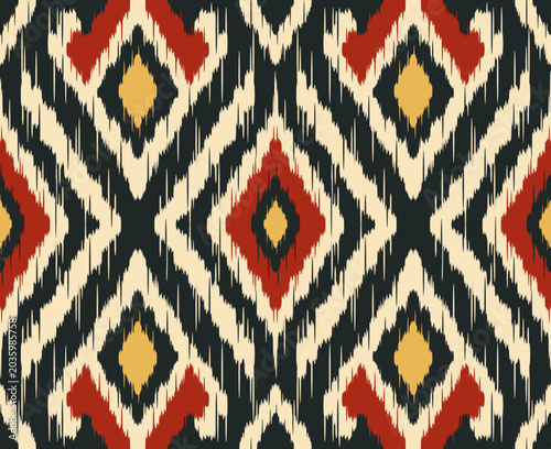 Traditional Ikat seamless pattern background with geometric diamond motifs