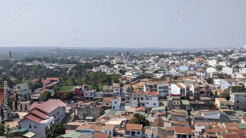 Cityscape in Buon Ma Thuot, Vietnam: Panoramic view of the residential area and lush greenery in the highland city in 2020