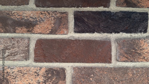 Cuadro en lienzo Dark red and brown clinker brick wall close up, macro textured background of rus