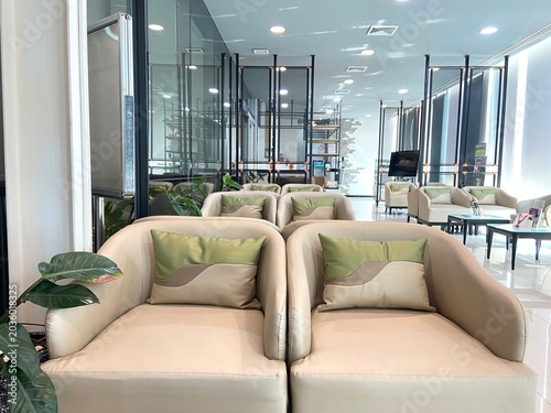 Modern Beige Sofa with Olive Green Cushions Contemporary Reception Design