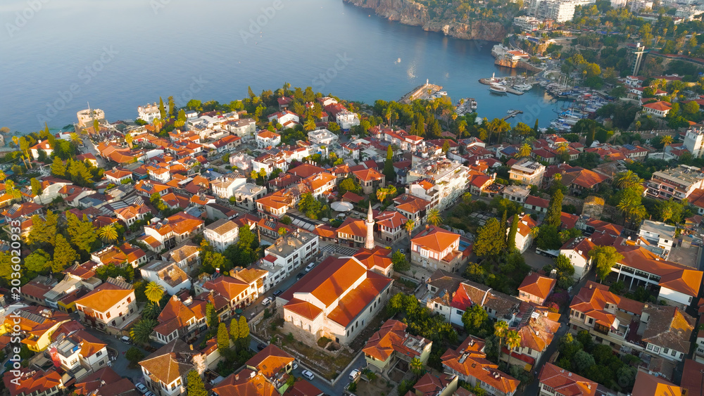 Fototapeta premium Antalya, Turkey. Aerial composition of historic Kaleici Old Town with Mediterranean Sea and yacht marina in morning sunlight.. Aerial View