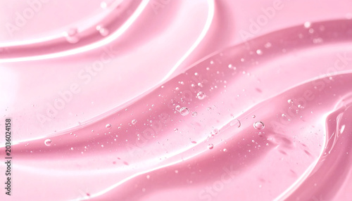 Close up of transparent pink cosmetic gel serum background