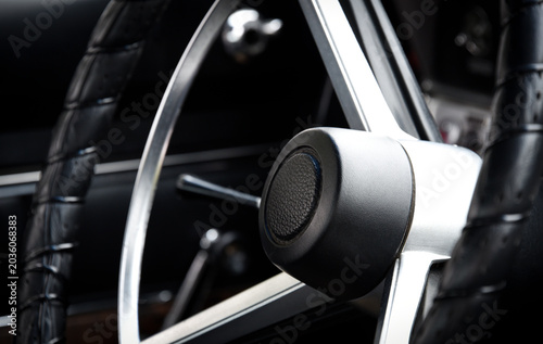 Steering wheel in a classic car at a car show