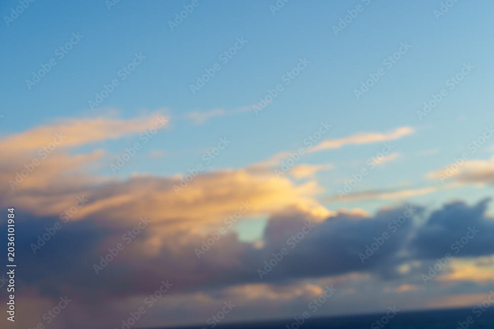 Naklejka premium Blues sky pink cloud ethereal background over land in silhouette.