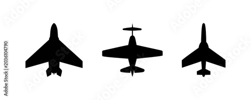 Bild auf Leinwand Three black silhouettes of different airplanes flying in the air