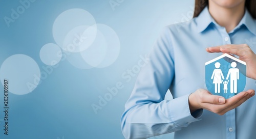 A business professional holding a stylized icon representing family protection and insurance services.