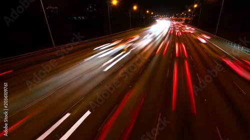 City Roads Glow In Motion. Dazzling Array Of Vehicle Streaks Creating Dynamic Cityscape At Dusk