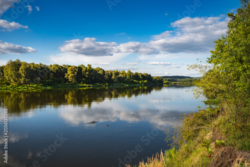 Landscape of the banks of the Bug River overgrown with forests and bushes