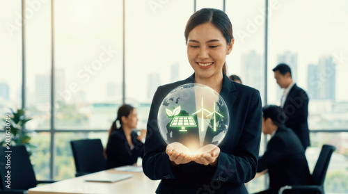 Renewable energy sustainable business green technology clean energy businesswoman hologram smiling office wind turbine