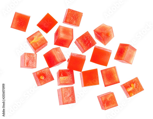 Dynamically falling tomato cubes isolated for food designers for the fresh design of pizza and pasta sauce packaging on a transparent background to inspire a desire for Mediterranean enjoyment