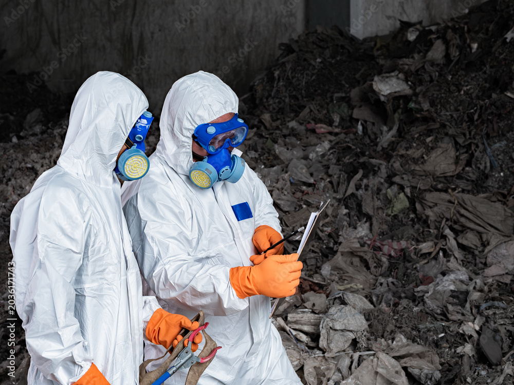 Ταπετσαρία Waste Inspection Team: Safety and Collaboration: Professionals in protective suits work together to assess waste, ensuring safety and environmental responsibility