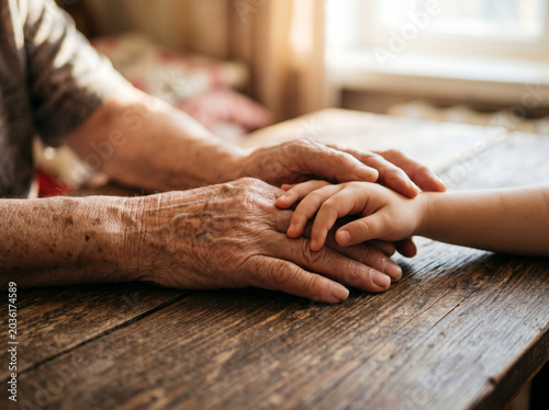 Intergenerational Bonding Elderly Hands Holding Child Hands Warmth
