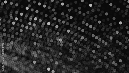 Obraz na plátně Abstract black background with shimmering bokeh light pattern