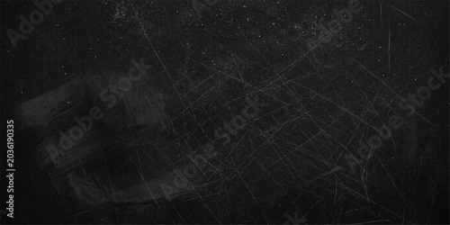 Photography A dusty, scratched blackboard reveals subtle hints of erased writing, evoking a sense of past lessons and academic history