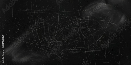 Tableau sur toile A dark, textured surface covered in numerous scratches and scuffs, suggesting wear, damage, or a distressed aesthetic, with subtle light reflections highlighting the chaotic pattern