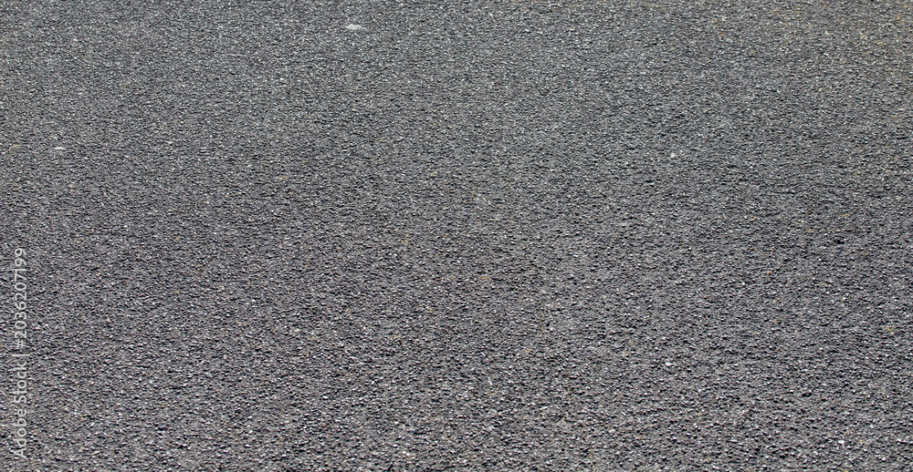 Fototapeta premium Fine dark grey asphalt road surface texture background for transport infrastructure and construction design