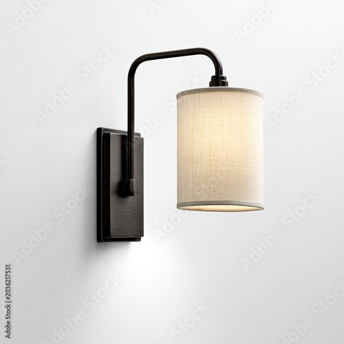 A contemporary wall lamp with a dark metal arm and linen shade