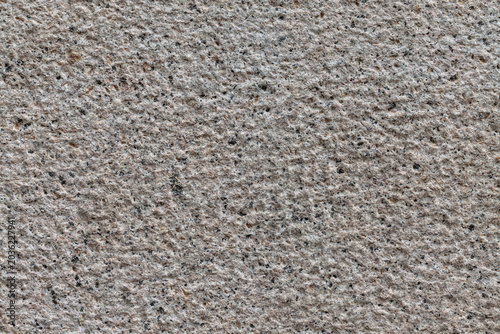 Uniformly chiseled granite stone background texture material macro