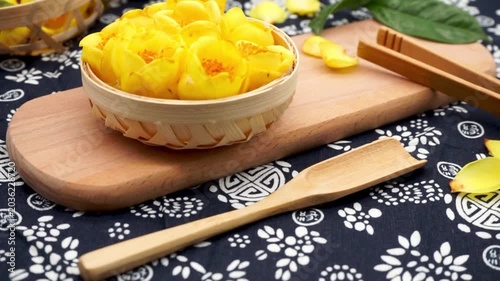 Yellow Edible Flowers on Wooden Cutting Board
