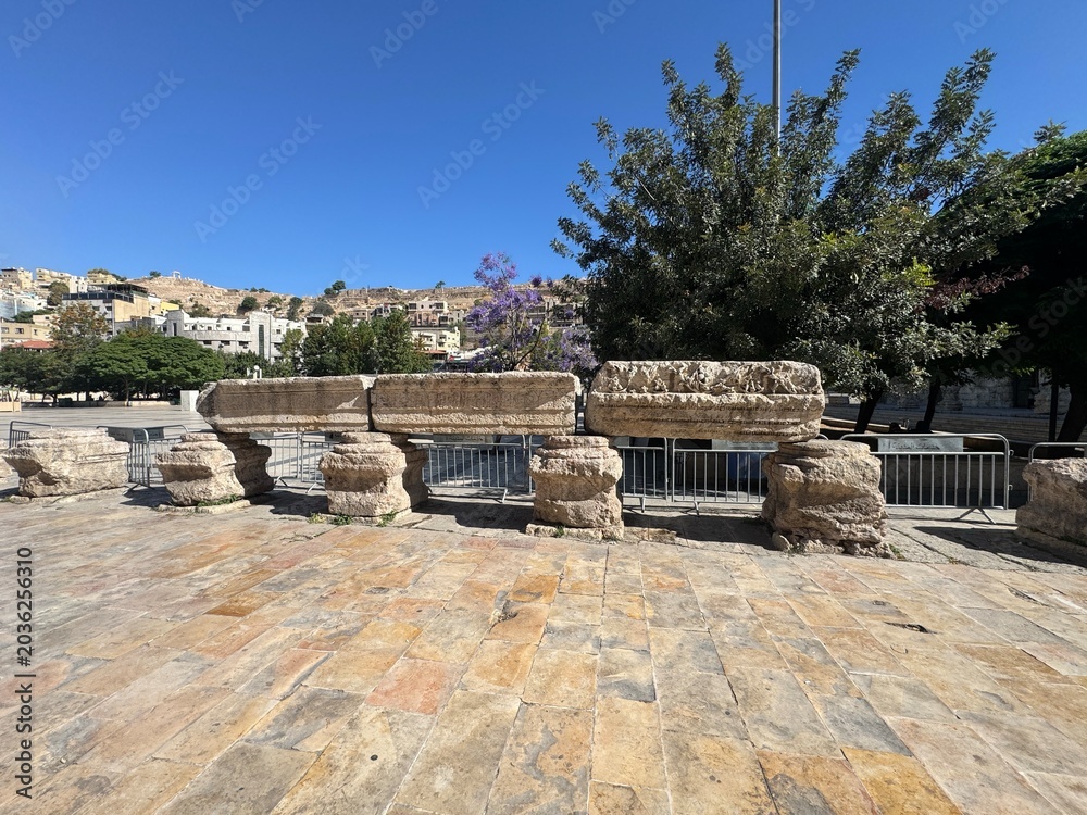 Fototapeta premium Amman, Jordan 25 May 2026: A striking wide-angle shot of the historic Roman Theatre in downtown Amman, Jordan. Built during the 2nd century AD under Emperor Antoninus Pius, this magnificent three-tier