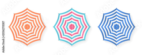 Set of striped beach umbrellas from a top down perspective ideal for summer vacation promotion and travel design