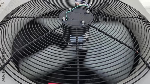 Operating air conditioner condenser fan viewed from above