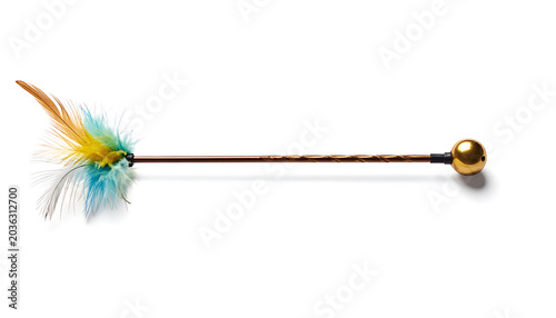 Isolated cat toy with colorful feathers and golden ball on a white background, playful pet accessory