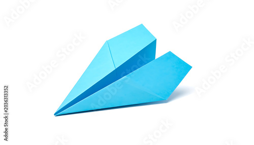 Isolated light blue paper airplane casting a soft shadow on a clean white background, symbolizing childhood, travel, and simplicity
