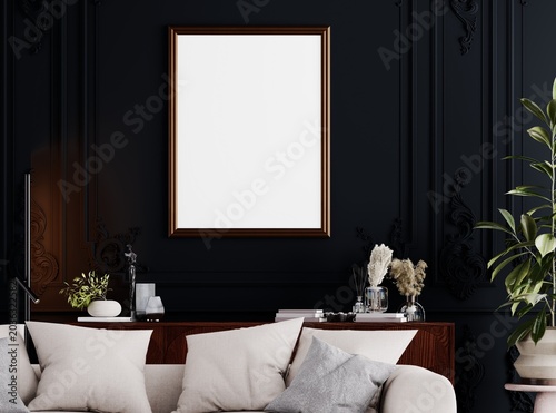 Elegant dark luxury interior with classic wall moldings, tufted sofa and vertical poster mockup frame.