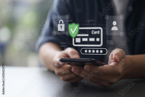 Secure online payment concept with person using smartphone for credit card transaction and identity verification.