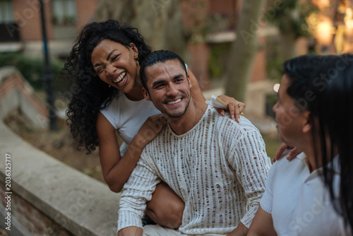 Foto Diverse friends enjoying happy urban outdoor gathering