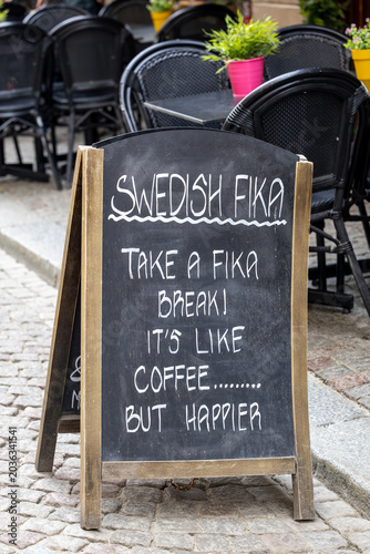 Canvas Print Stockholm, Sweden A blackboard sign for Swedish Fika on a sidewalk