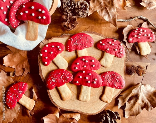 Tableau sur toile Cute red mushroom cookies with autumn leaves and cozy woodland aesthetic