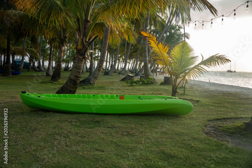Plastic kayak on Nugnudub Island at sunset, in the San Blas Islands, off the Caribbean coast of Panama