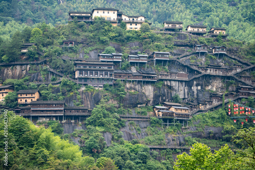 Photos Traditional houses built on the steep cliff side in Wangxian Valley Scenic Area