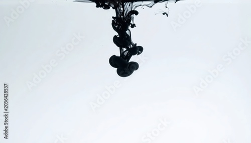 Black Ink Cloud Spreading in Clear Water on Minimal White Background