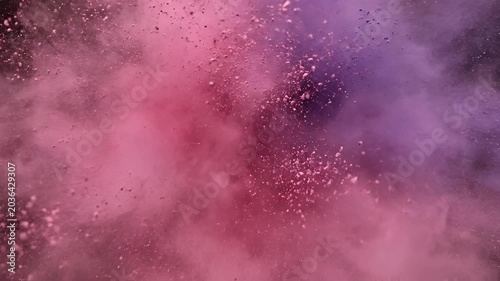 Explosion of Pink and Purple Powder Against Black Background.