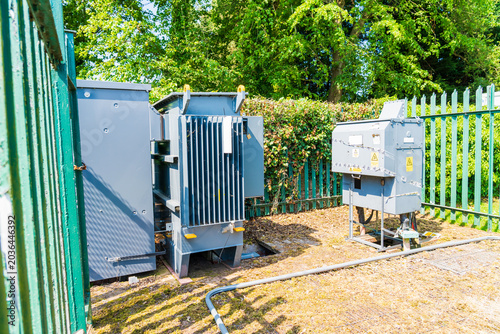 Tableau sur toile An outdoor electrical substation enclosure featuring industrial power distributi