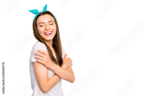 Photography Portrait of positive cheerful lovely girl hug herself feel dreamy copyspace have