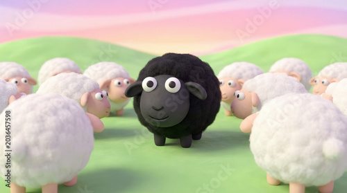 Fotografie Black sheep standing out among white sheep in a field
